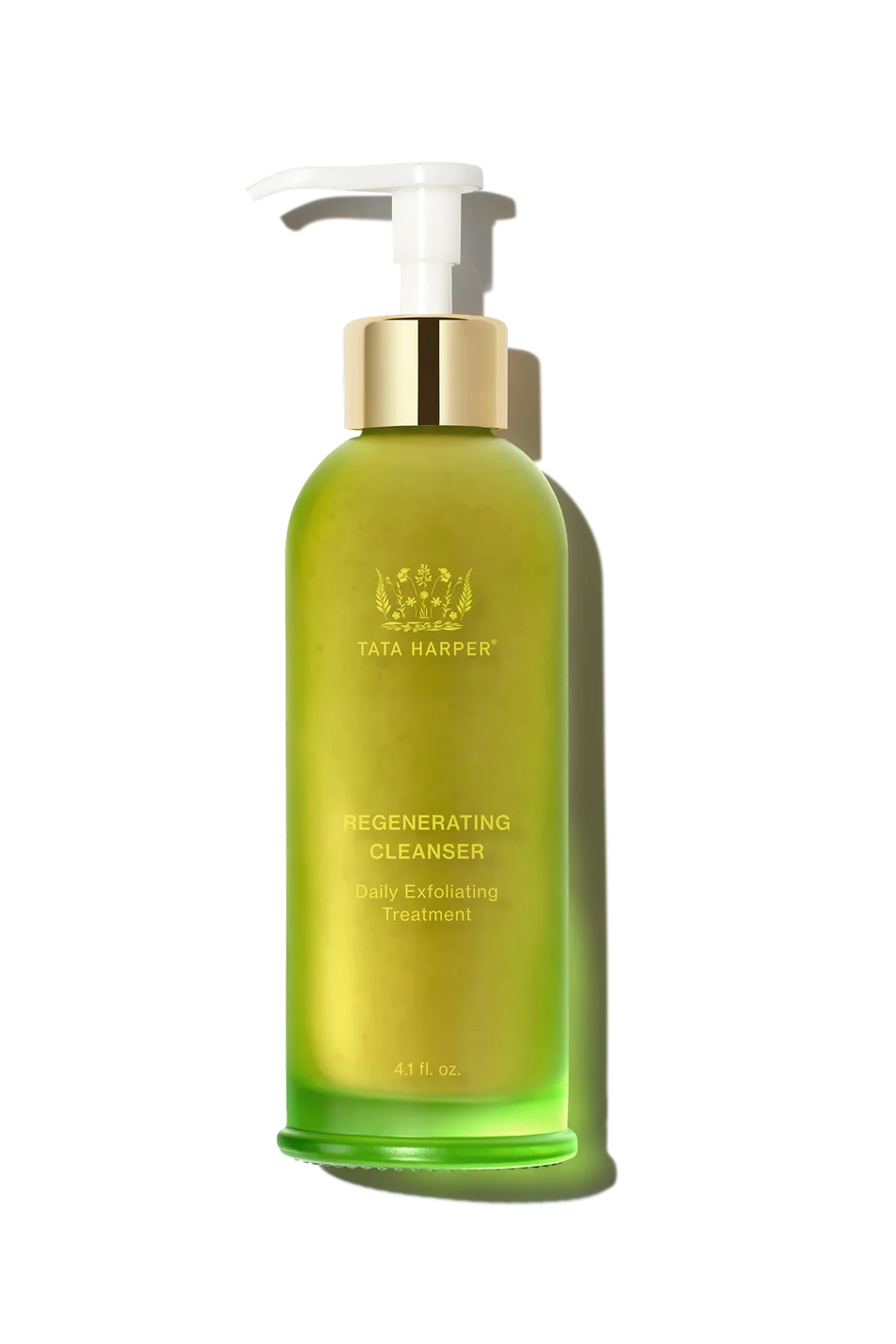 A bottle of Tata Harper Regenerating Cleanser with a white pump and a metallic gold collar, set against a clean white background with a soft shadow.