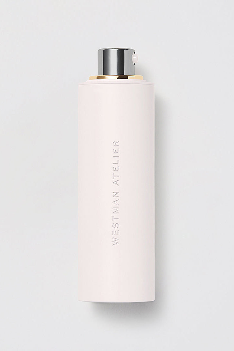 White cylindrical container with silver cap on a light gray background