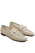 Pair of beige loafers with a textured pattern on a light gray background
