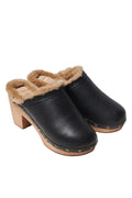 Black clogs with brown fur lining on a white background